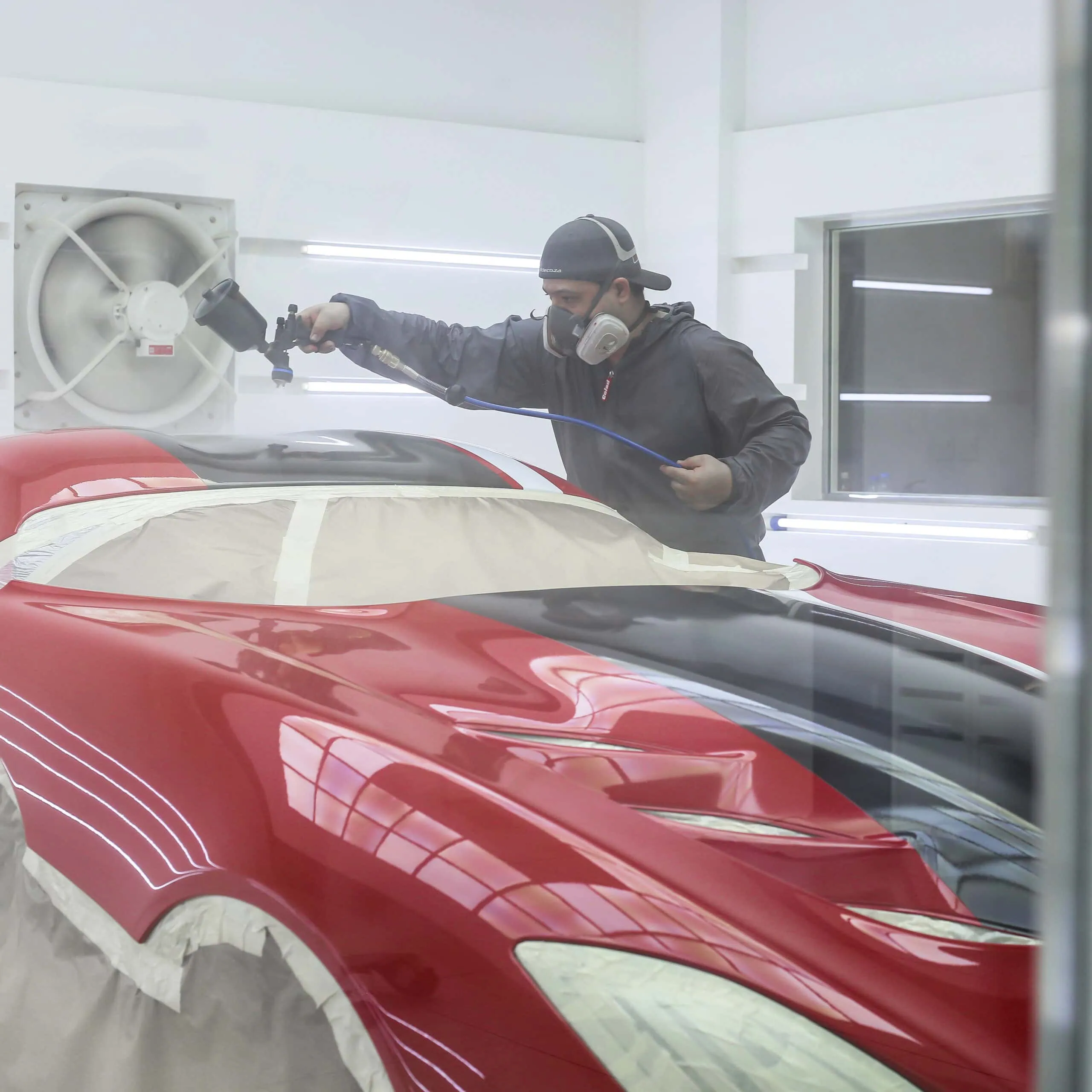 Spray application in booth